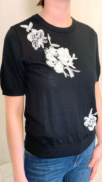 White 3d embroidery on black pullover