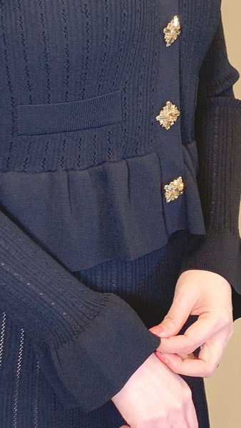 Black rayon trumpet sleeve dress with gold rhinestone buttons