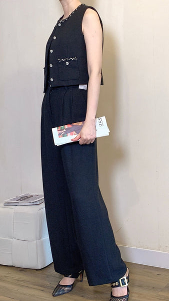 Black silhouette work pants with rhinestone button