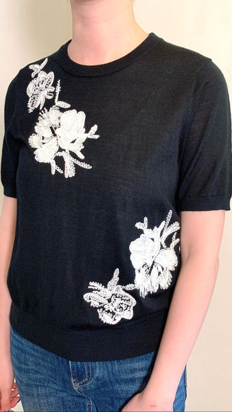 White 3d embroidery on black pullover