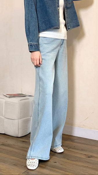 Pale blue soft wide leg jeans with embroidered pockets