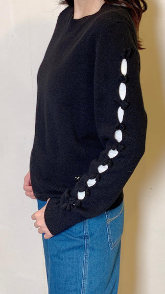 Black wool sweater with cut-out bow