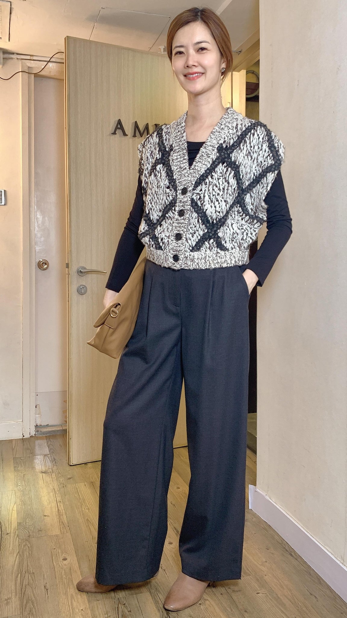 Grey knitted waistcoat with sequined cross pattern