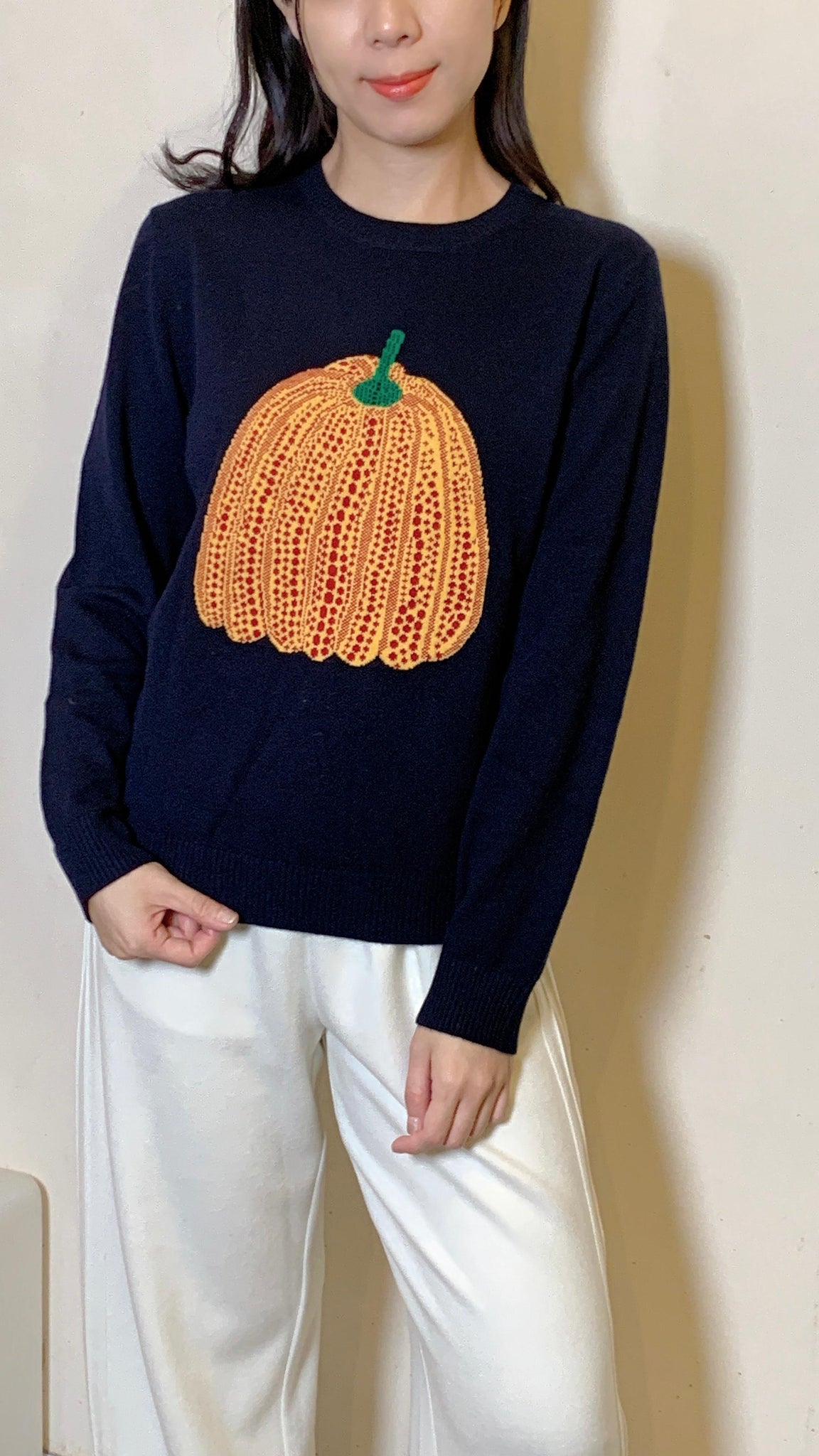 Pumpkin motif on navy wool sweater