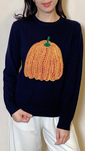 Pumpkin motif on navy wool sweater