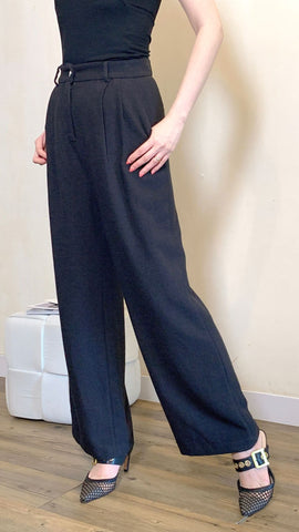 Black work pants with a rhinestone button