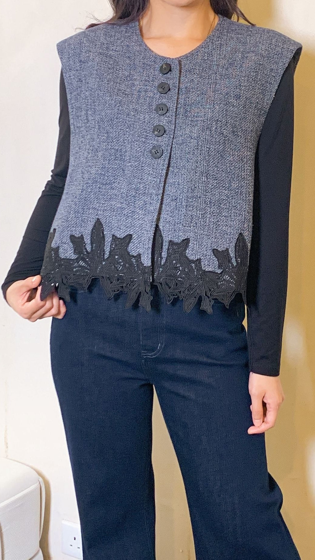 Dark denim wool vest with floral hem