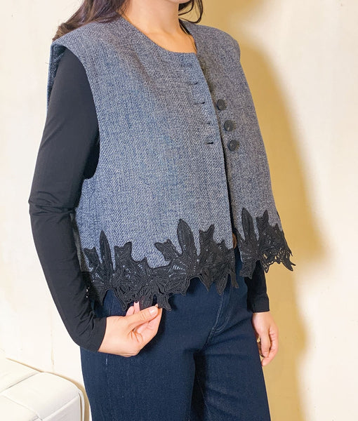 Dark denim wool vest with floral hem