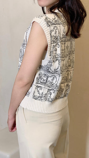 Cream white alphabets embroidered sleeveless top